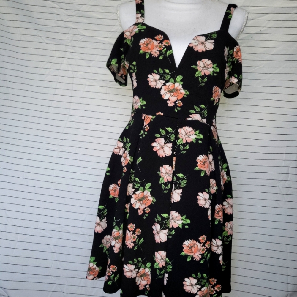 Floral off the shoulder black dress with criss cross back.
